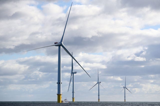 A view of several wind turbines at sea
