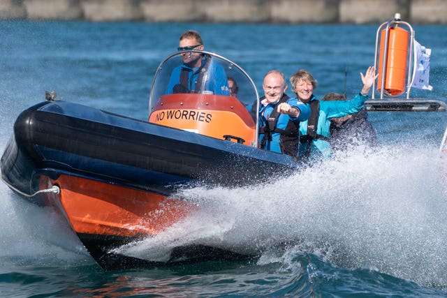 Liberal Democrat leader Sir Ed Davey (second right) and energy spokeswoman Pippa Heylings (right) travel in a speed boat to visit Rampion wind farm