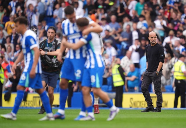 Manchester City manager Pep Guardiola looks frustrated following defeat at Brighton