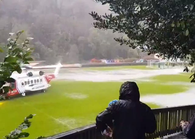 A Coastguard helicopter on Laxey football pitch in the Isle of Man
