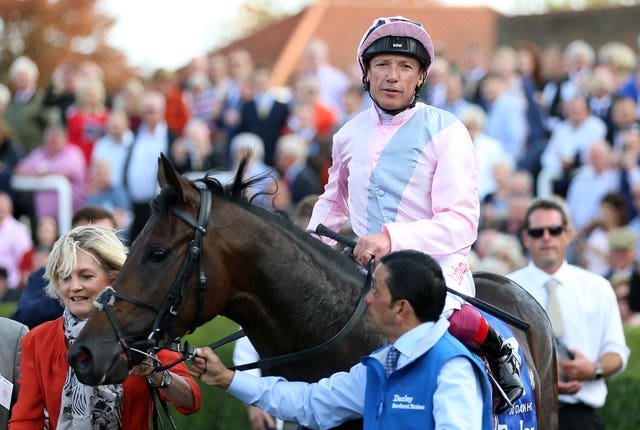 Frankie Dettori and Too Darn Hot after winning the Dewhurst Stakes
