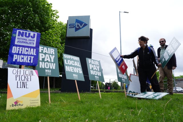 STV staff and placards on a picket line