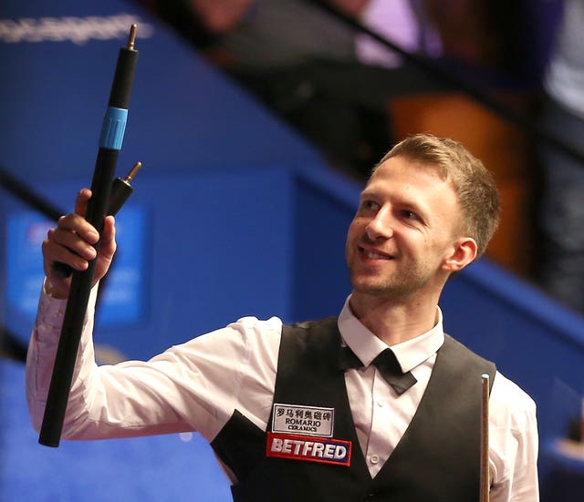 Judd Trump celebrates after his 10-9 victory 