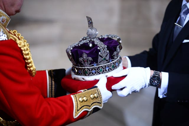 The Imperial State Crown is carried through the Sovereign’s Entrance ahead of the State Opening
