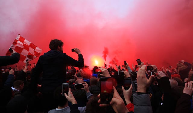 The behaviour of Liverpool fans will be under scrutiny after Manchester City's coach was damaged on their Champions League quarter-final visit.