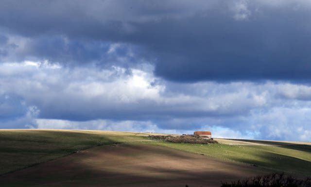 A view of farm buildings on the South Downs near Eastbourne in Sussex