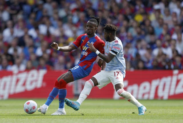 Crystal Palace’s Wilfried Zaha and Manchester United’s Fred battle for the ball