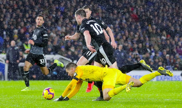 Brighton goalkeeper Mathew Ryan, left, fouled Ashley Barnes for Burnley third goal