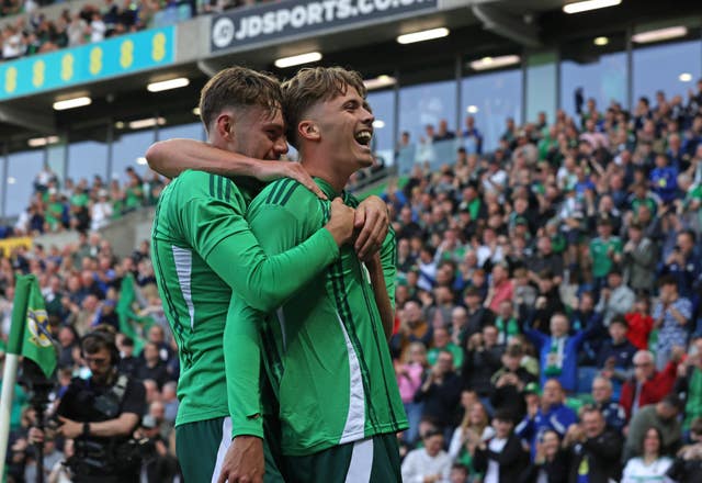 Isaac Price, right, celebrates scoring for Northern Ireland