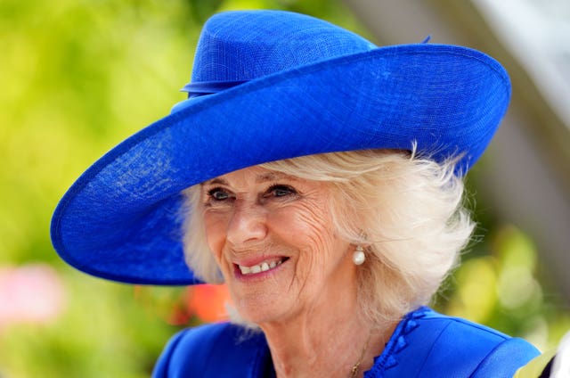 Camilla in a blue hat