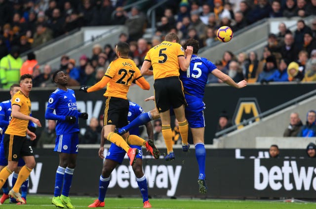 Ryan Bennett, second right, climbs highest to head Wolves' second goal