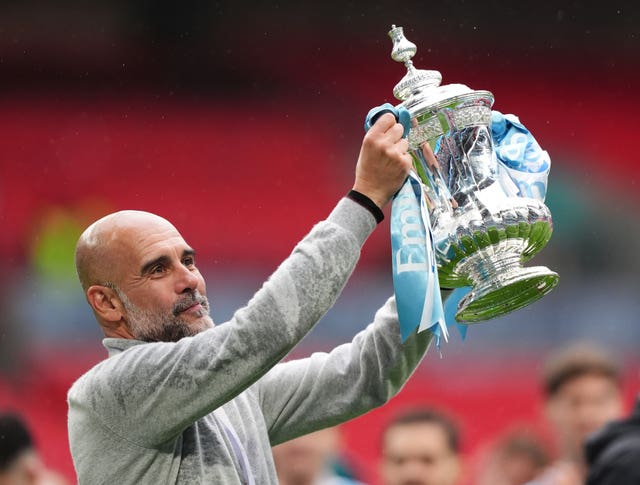 Pep Guardiola lifts the FA Cup in May 2026