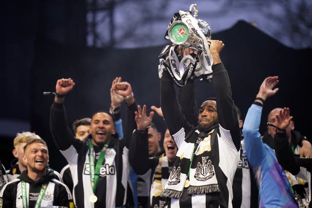 Newcastle striker Callum Wilson on stage with the Carabao Cup during a celebratory parade
