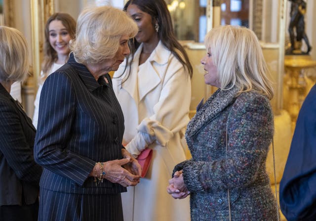 Camilla, left, speaking to Elaine Paige, right, in 2023