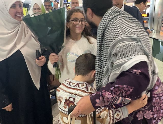 Sami Hamdi hugging family