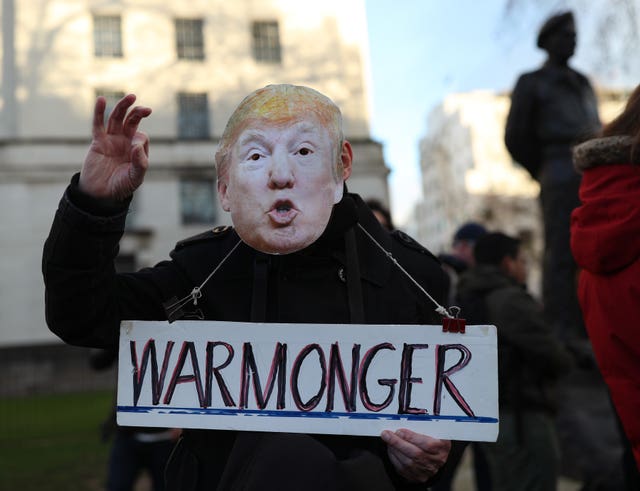One protester wore a Donald Trump mask