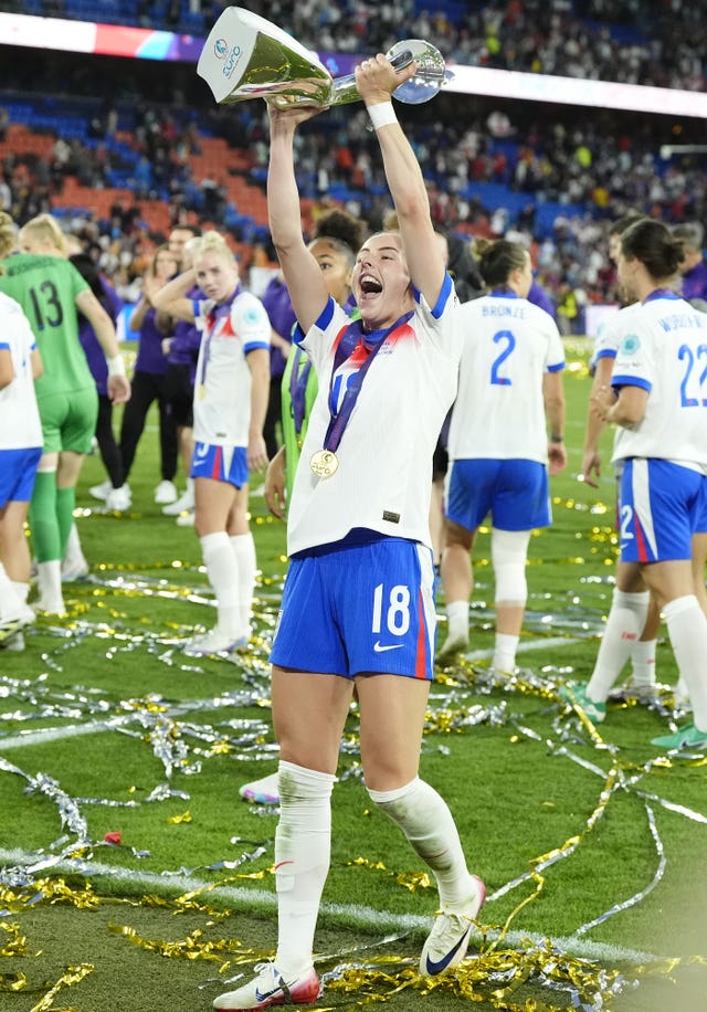 England’s Chloe Kelly celebrates with the trophy after scoring the winning penalty in the UEFA Women’s Euro 2025 final at St. Jakob-Park in Basel,