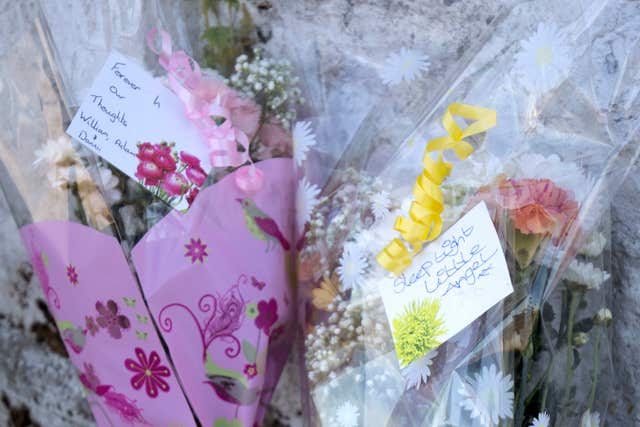 Floral tributes near a house on Ardbeg Road on the Isle of Bute