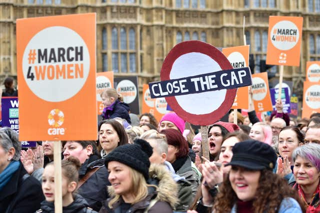 Marchers gather outside the Palace of Westminster (Dominic Lipinski/PA)