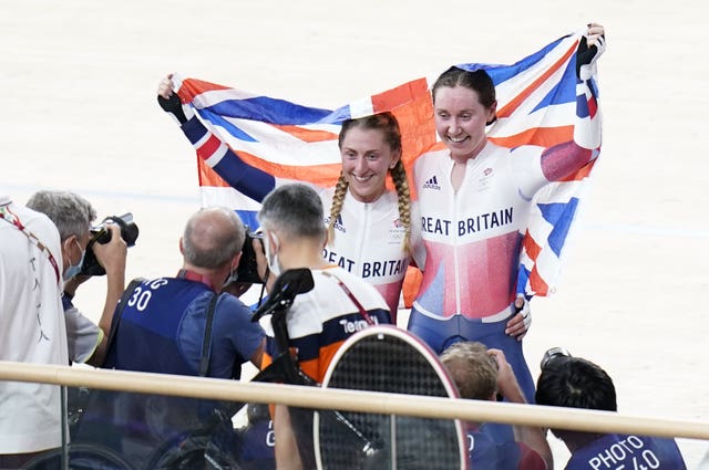 Kenny and Katie Archibald celebrate winning gold in the women's Madison final