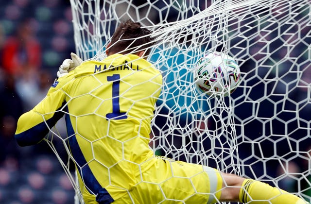 Scotland goalkeeper David Marshall crashes into the back of the net after conceding the second goal scored by Czech Republic's Patrik Schick