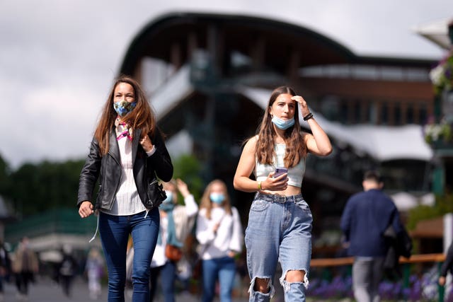 Spectators head for Centre Court on the day it re-opens at full capacity