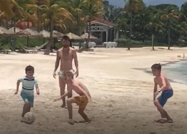 Mackenzie O'Neill playing football with Messi