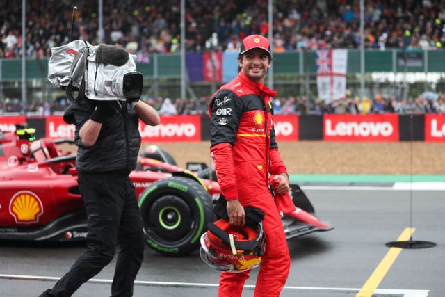 Carlos Sainz celebrates after claiming his first pole in Formula One