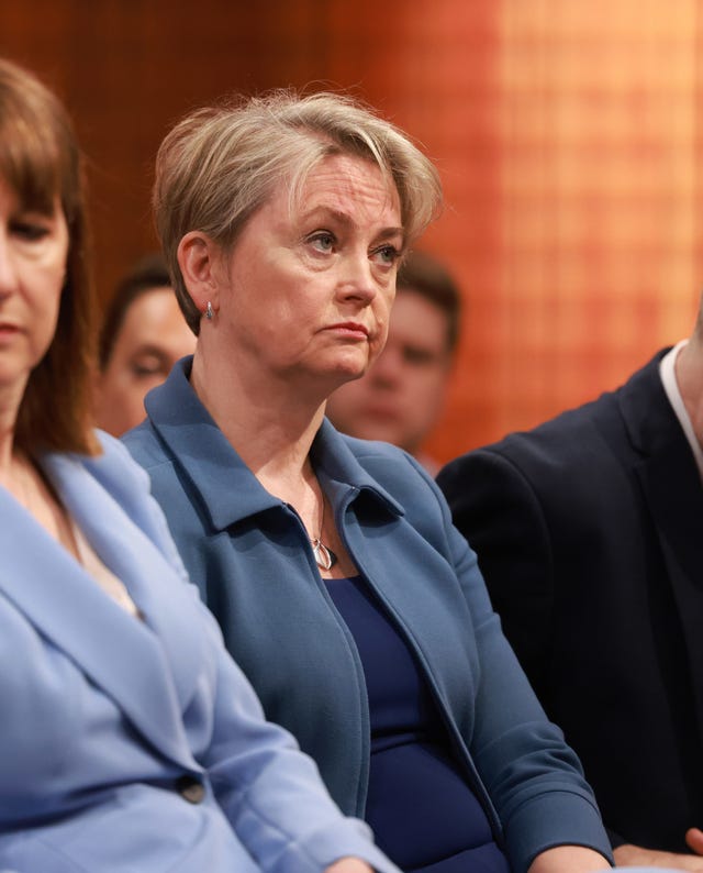 Home Secretary Yvette Cooper listens to the Prime Minister during a press conference on the Immigration White Paper in the Downing Street Briefing Room in London