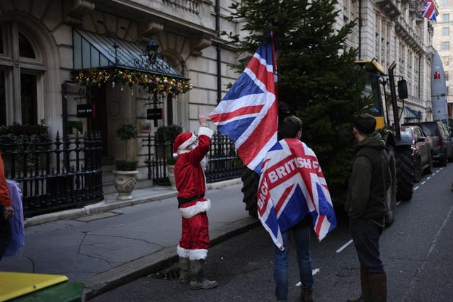 A demonstrator dressed as Santa