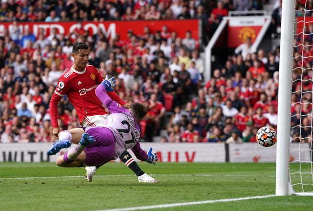 Cristiano Ronaldo, left, scores the opening goal