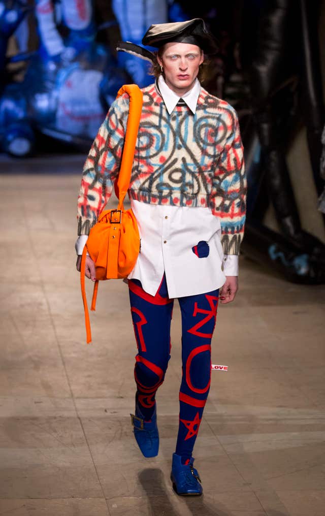 A model carries a manbag at a London Fashion Week show.