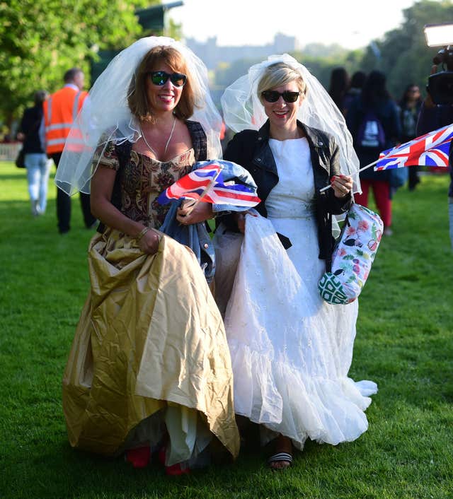 Royal brides: Fans dress for the occasion in Windsor (David Mirzoeff/PA)