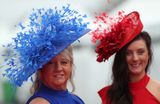 Flamboyant headwear is the order of the day at Aintree (David Davies/PA)