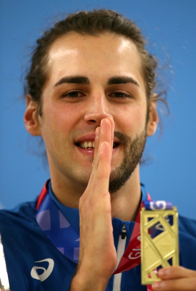 Italy’s Gianmarco Tamberi, sporting his trademark half-beard, with his high jump gold medal