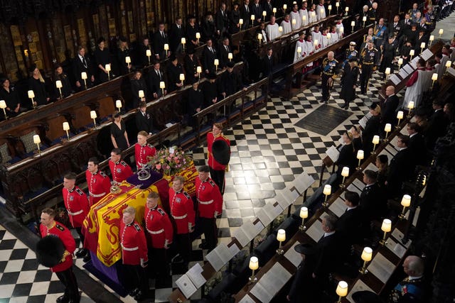 The Queen's coffin is carried by the bearer party into the committal service at St George’s Chapel in September