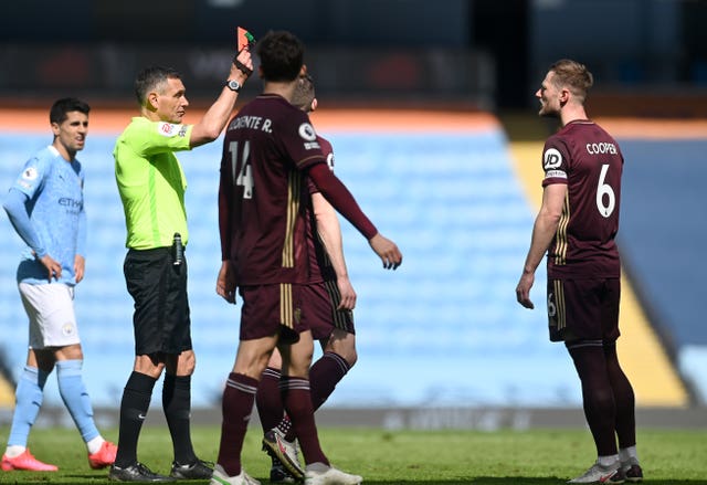 Leeds captain Liam Cooper, right, is back in contention after serving a three-match ban