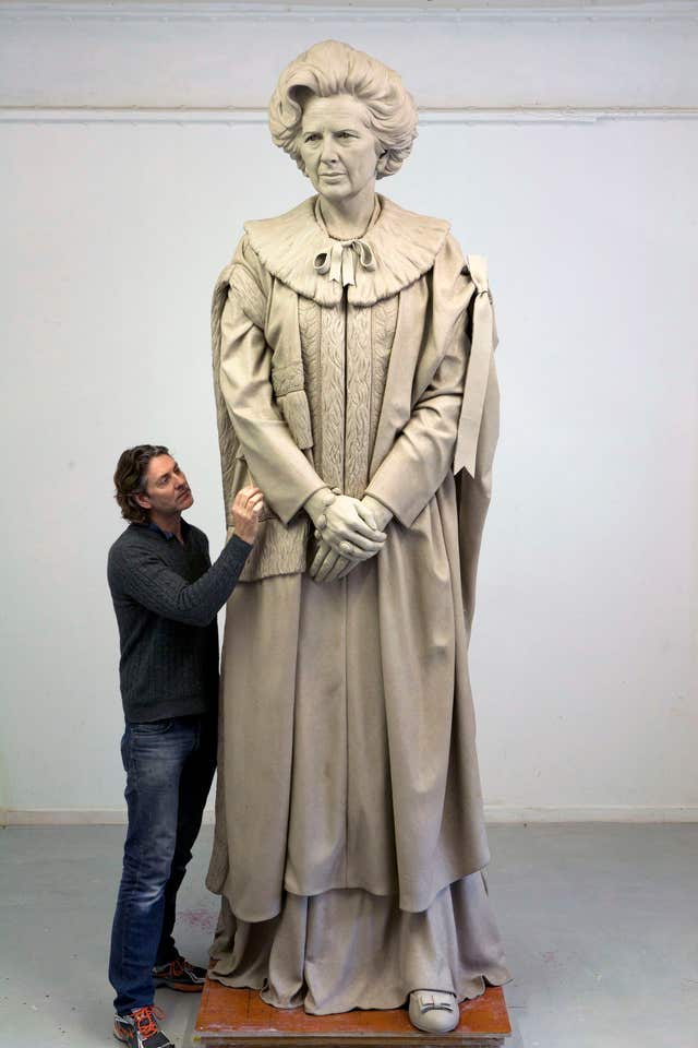 Undated handout photo issued by Fine Architecture of sculptor Douglas Jennings working on his statue of Margaret Thatcher (Douglas Jennings/PA).