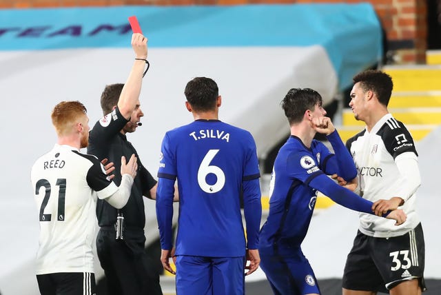 Fulham's Antonee Robinson (right) is shown a straight red card