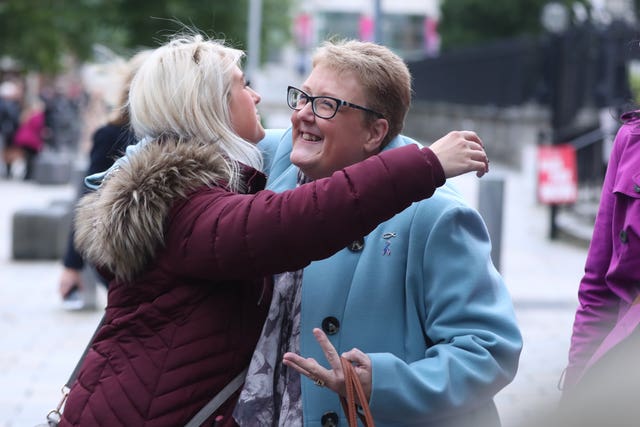 Sarah Ewart hugs her mother Jane Christie outside the High Court in Belfast