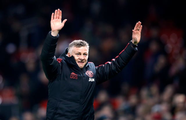 Manchester United interim manager Ole Gunnar Solskjaer celebrates victory over Huddersfield