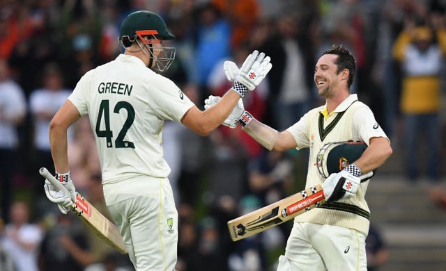 Travis Head, right, celebrates his century with Cameron Green