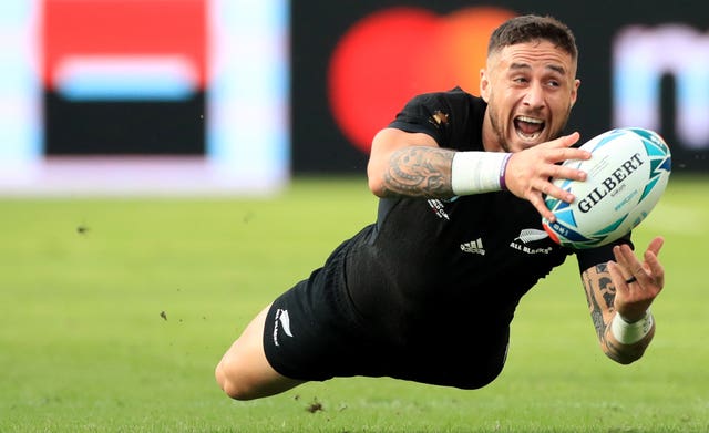 New Zealand's TJ Perenara dives during the match against Namibia
