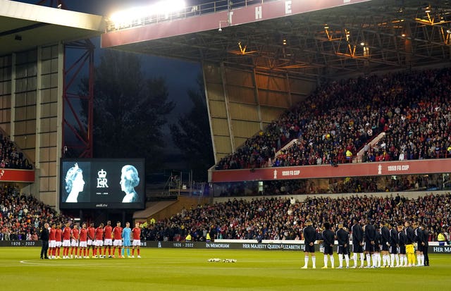Forest and Fulham players stand for a minute's silence