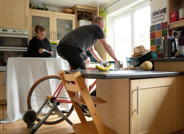 A photo issued by Historic England from its Picturing Lockdown Collection of Ann and Alun Ball at home in Fulwood, Sheffield, by Historic England photogapher Alun Bull