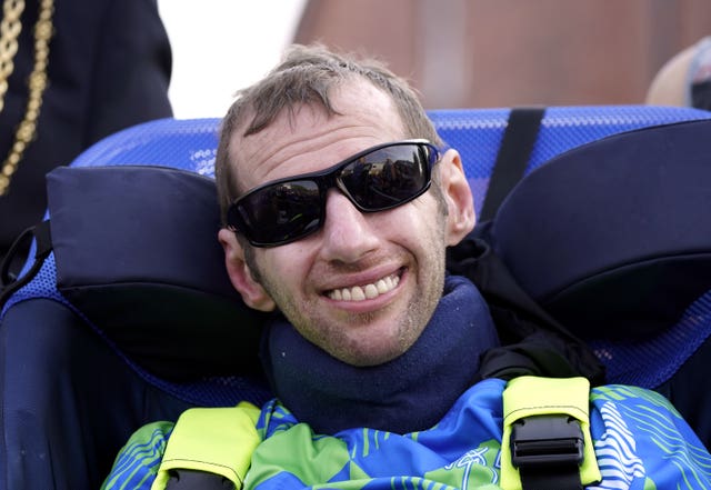 Rob Burrow with sunglasses on in his chair