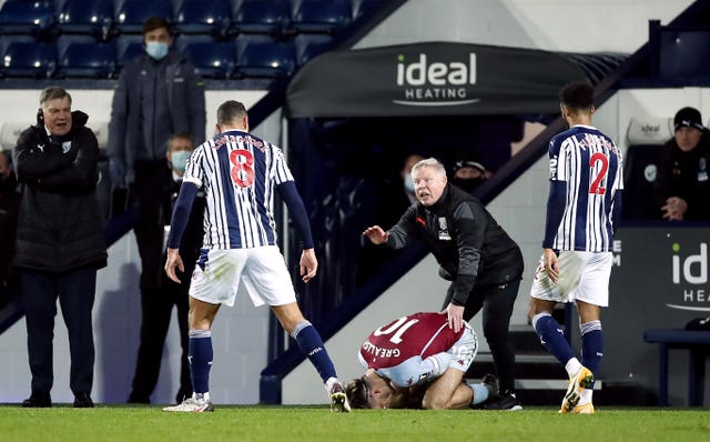 Jack Grealish lies injured after Jake Livermore's red-card challenge