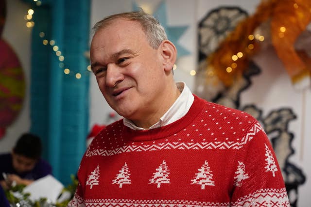Sir Ed Davey wearing a red Christmas jumper