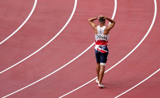 Adam Gemili walks the track after pulling up injured during the men’s 200m heats