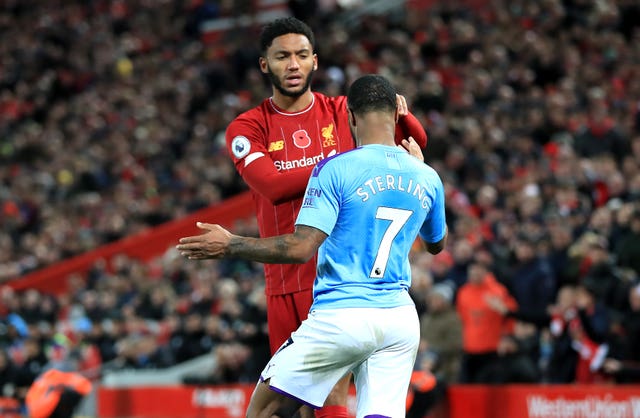 Raheem Sterling clashes with Joe Gomez, left, in Manchester City’s defeat to Liverpool